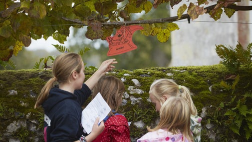 Children on a Halloween trail at Mottisfont, Hampshire, in autumn
